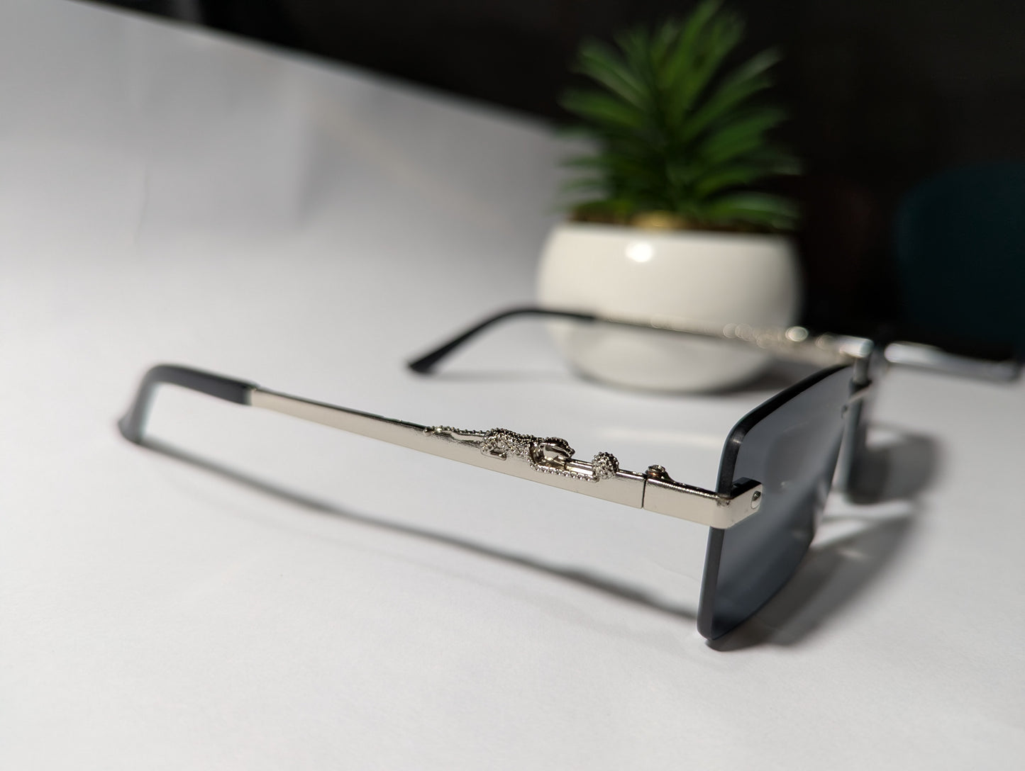 The Classic Edge: Silver Rimless Jaguar Sunglasses 🕶️