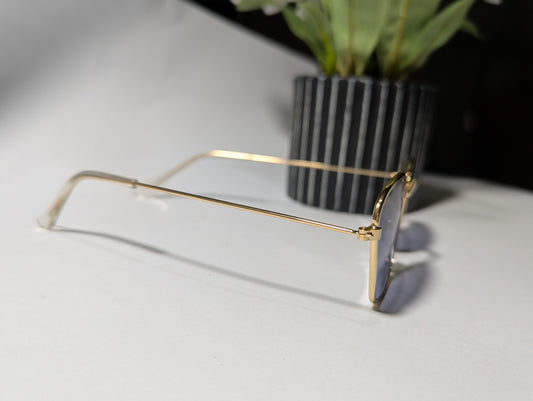 geometric luxe: gold frame angular sunglasses with twilight tint
