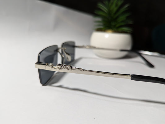 The Classic Edge: Silver Rimless Jaguar Sunglasses 🕶️