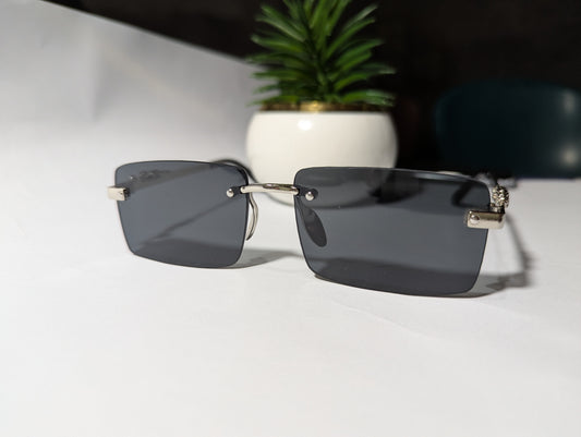 The Classic Edge: Silver Rimless Jaguar Sunglasses 🕶️