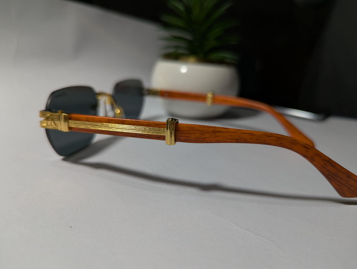 The Royal Look: Prince Rimless Sunglasses with Gold and Wood Accents