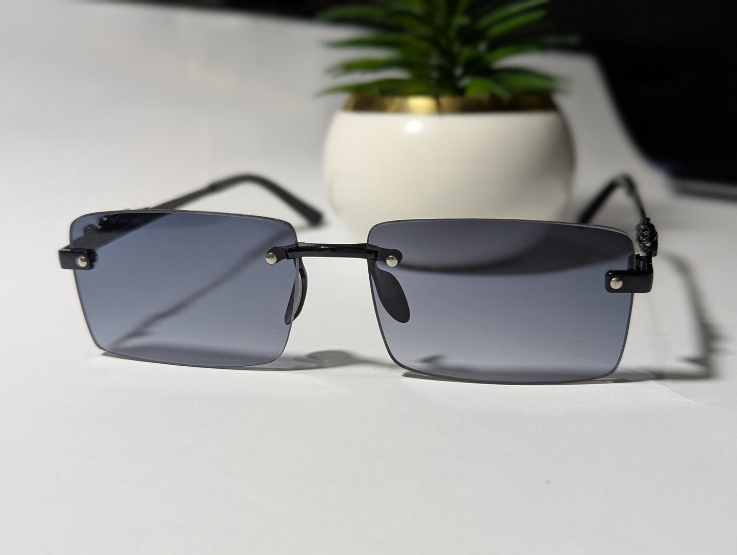 The Stealth Panther: All-Black Rimless Jaguar Sunglasses 🌑