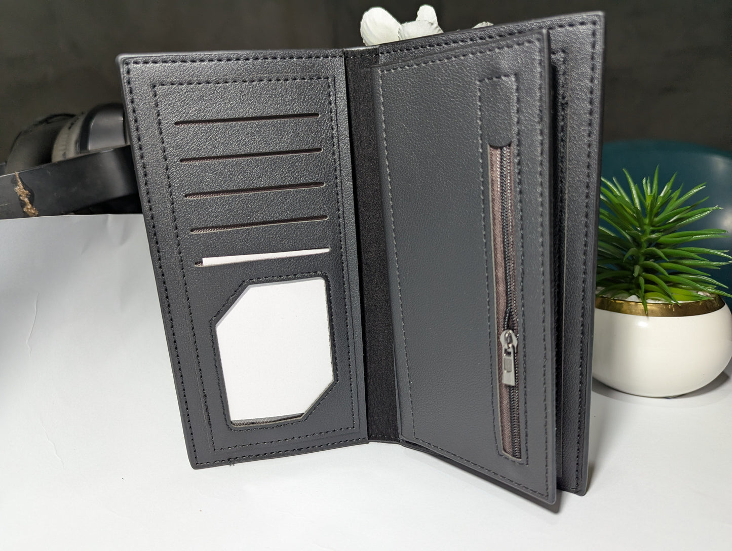 The Gotham Traveler: Sleek Black Leather Trench Wallet - Emblem Edition