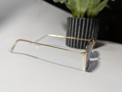 geometric luxe: gold frame angular sunglasses with twilight tint